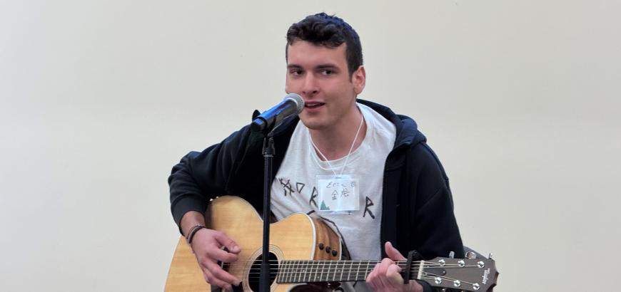 UW student Eric Schaefer performs a song from the movie Crazy Rich Asians.